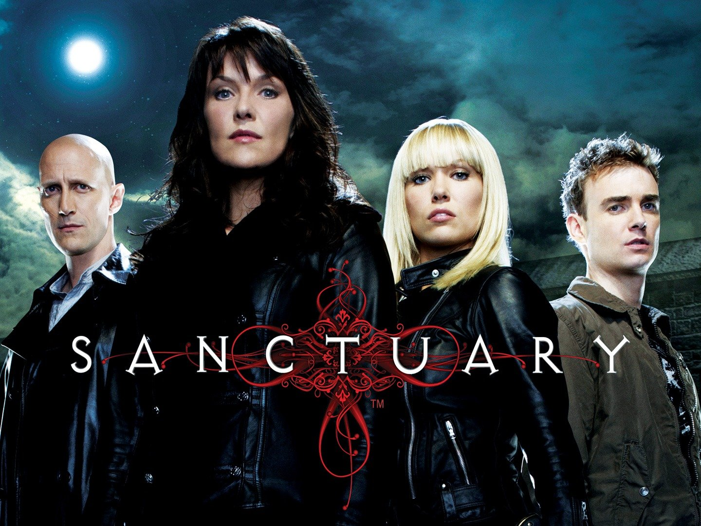 The main characters of sanctuary lined up in fornt of a full moon during a cloudy night.