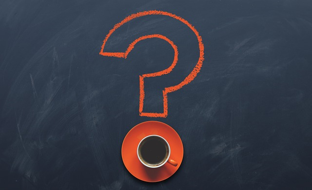 ask, question mark on a blackboard with a coffee cup in the dot