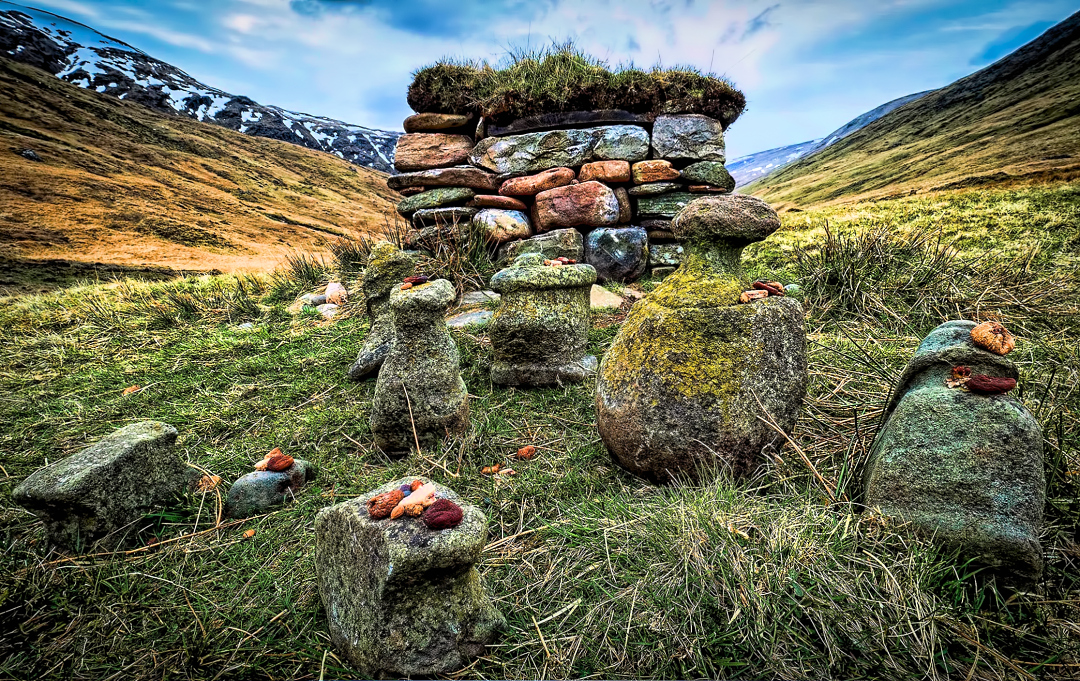 Carefully placed stones surrounding an ancient Celtic stone house in the landscapes of Sottish Highlands.