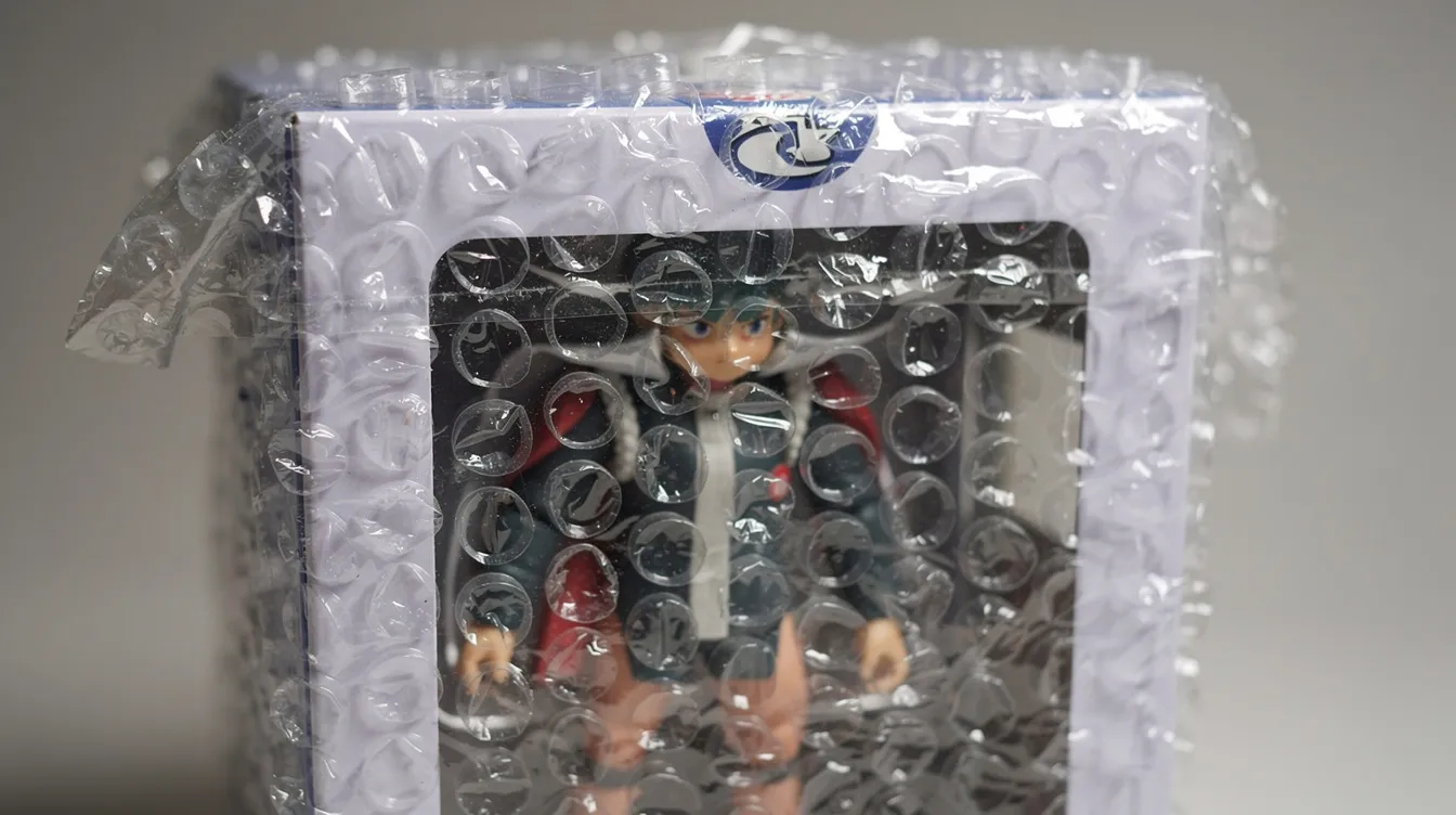 The image shows a close-up of a boxed collectible anime figure, carefully wrapped in bubble wrap to ensure its protection during shipping. This collectible is perfect for anime fans looking to expand their collection with authentic pieces from Japanese stores.