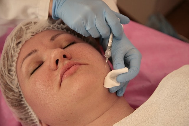 dermatologist helping patient