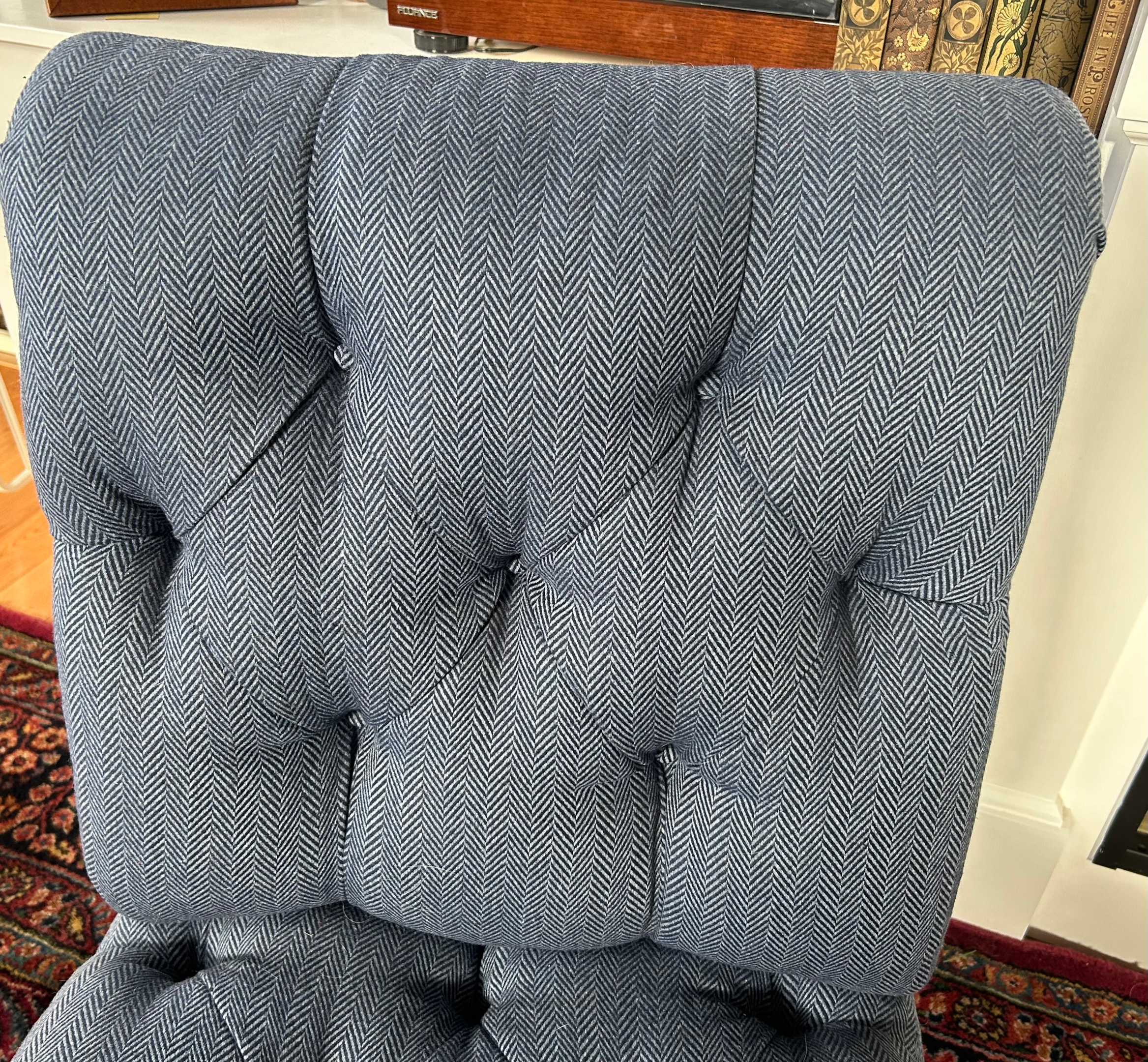 Tufted back of an antique slipper chair