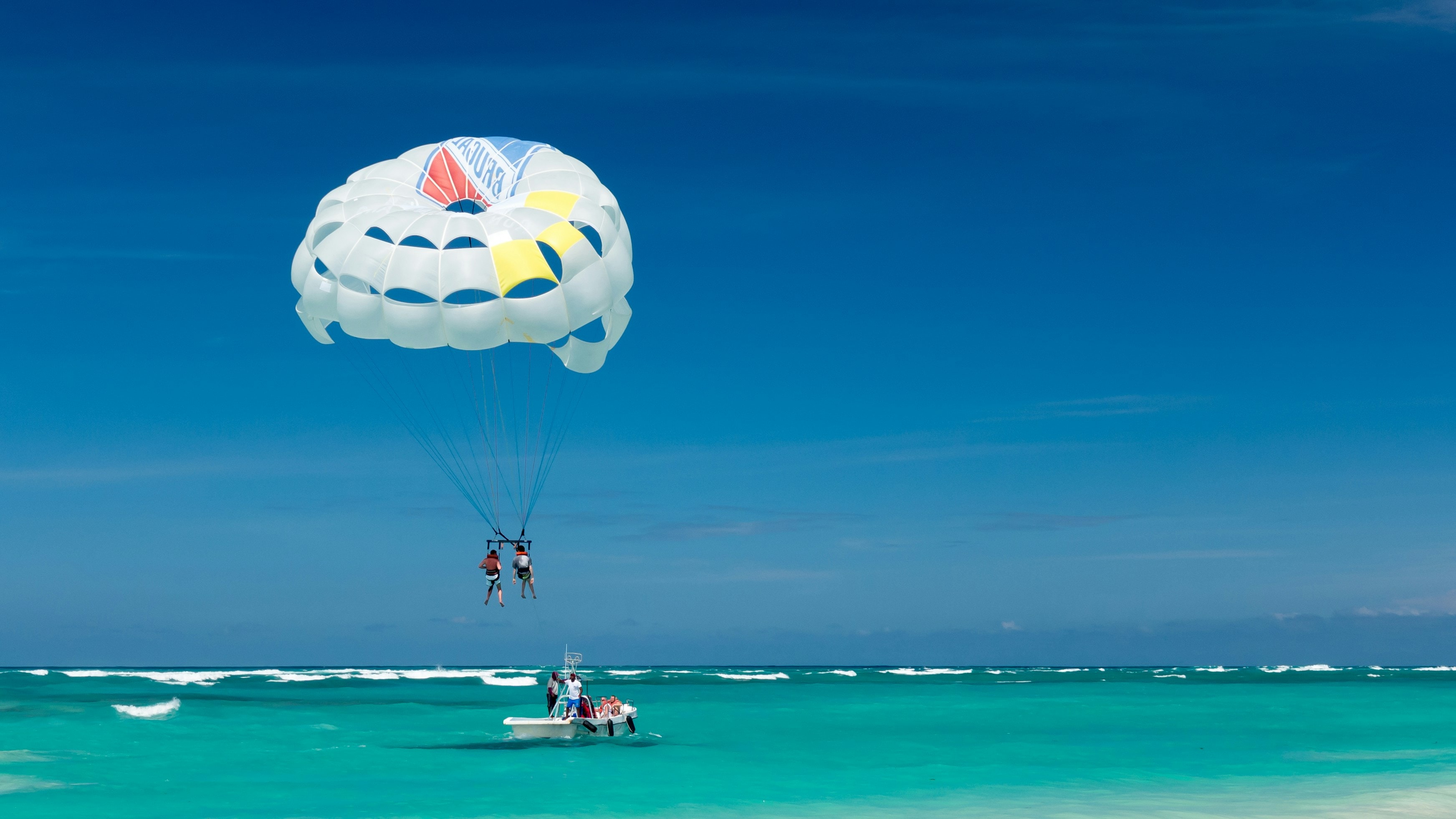 Photo by <a href="https://unsplash.com/@mustangjoe?utm_content=creditCopyText&utm_medium=referral&utm_source=unsplash">Joe deSousa</a> on <a href="https://unsplash.com/photos/two-person-riding-parachute-near-beach-kUvMjq3ETuQ?utm_content=creditCopyText&utm_medium=referral&utm_source=unsplash">Unsplash</a> 

Fun Facts About the Dominican Republic