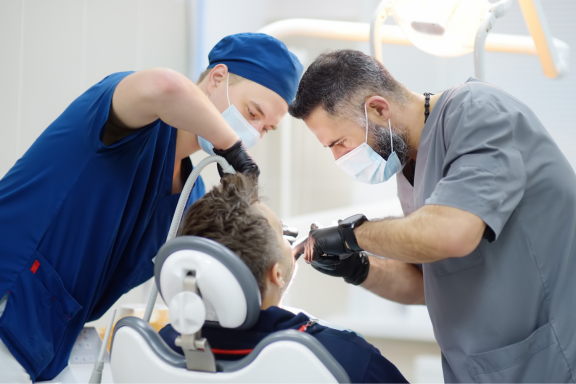 oral and maxillofacial surgeons performing bone reconstruction on missing teeth 