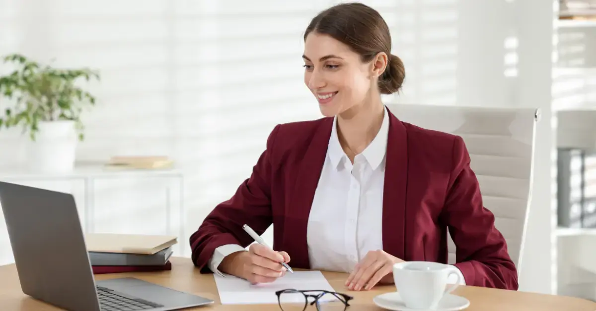 Woman generating financial reports after completing catch-up bookkeeping.