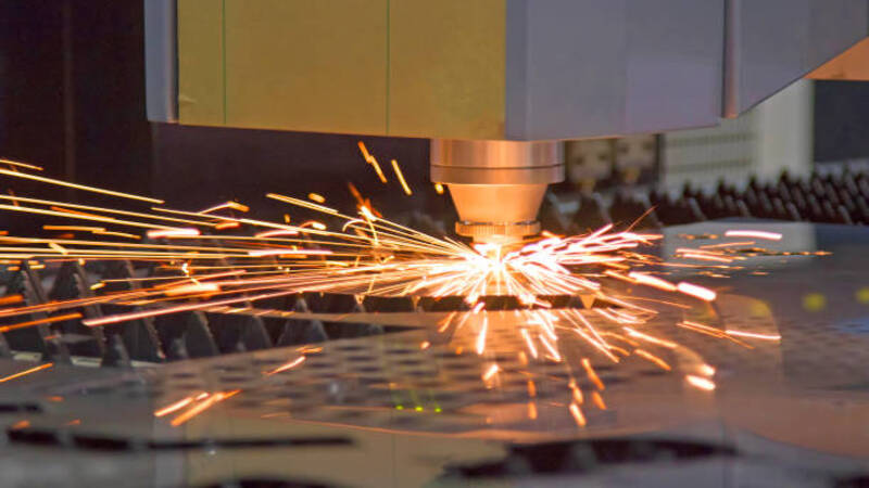 A laser cutting cutting metal sheets. 