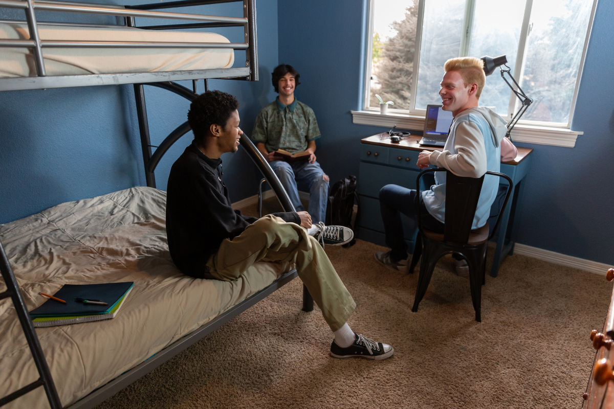 An artistic representation of a well-organized college dorm room showcasing essential items.