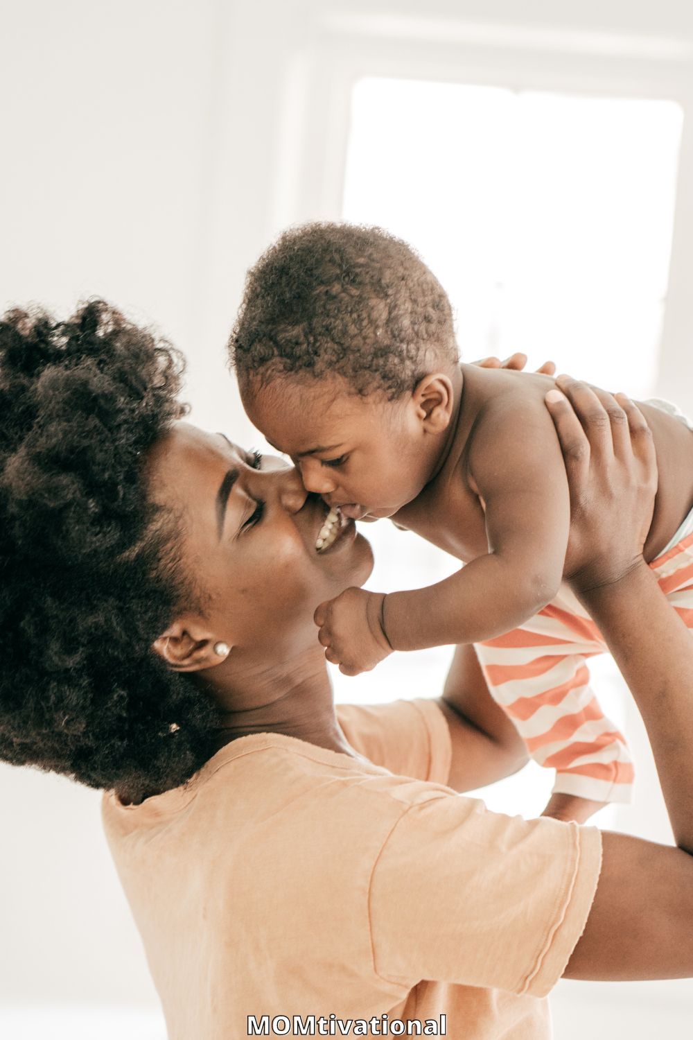 New mom playing with her baby - Featured in : Breastfeeding Tips For New Moms