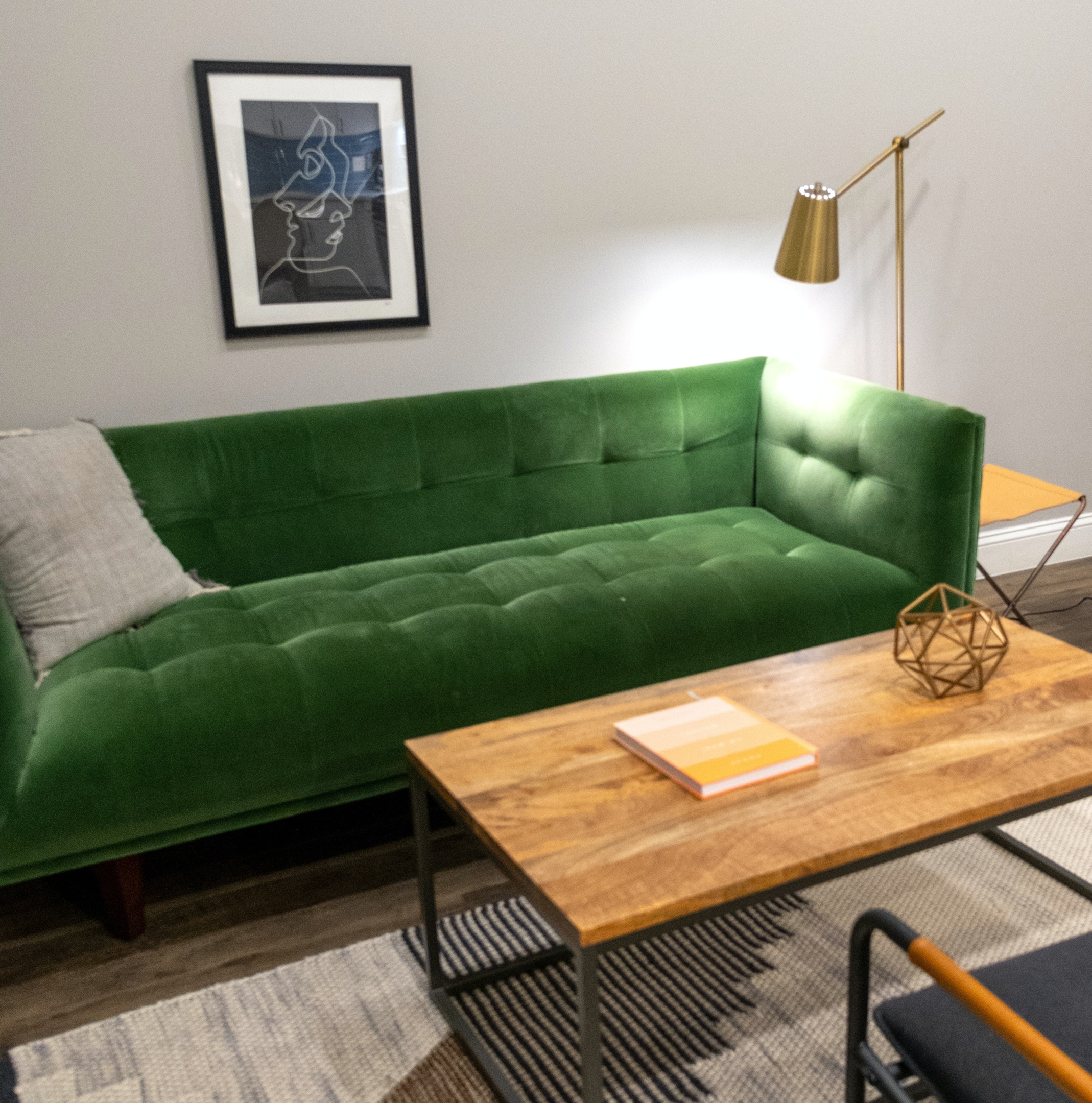 green velvet tufted couch