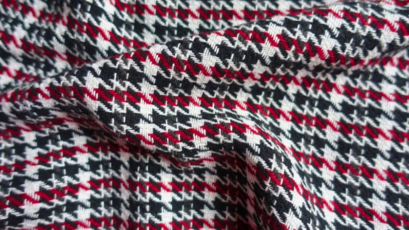 A close-up of a red and black checkered twill fabric