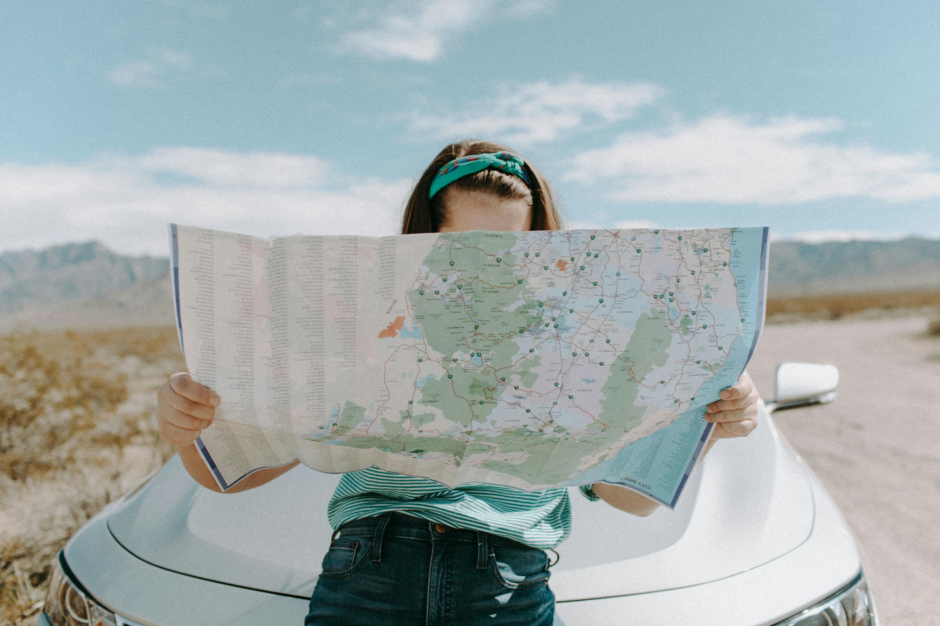 Person analyzing map of the United States.