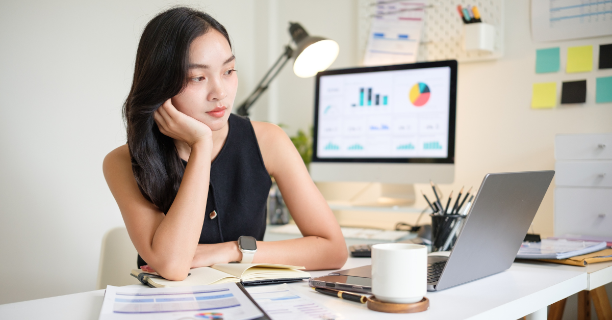 A female influencer reviewing income documents and asking herself, do influencers pay taxes on gifts.