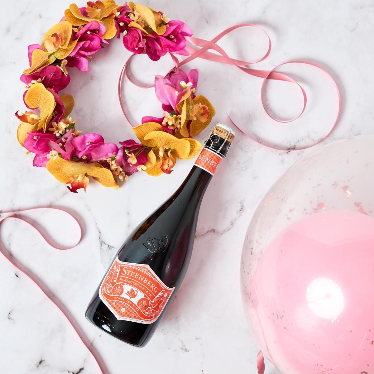 faux flower crown and champagne, with a helium balloon