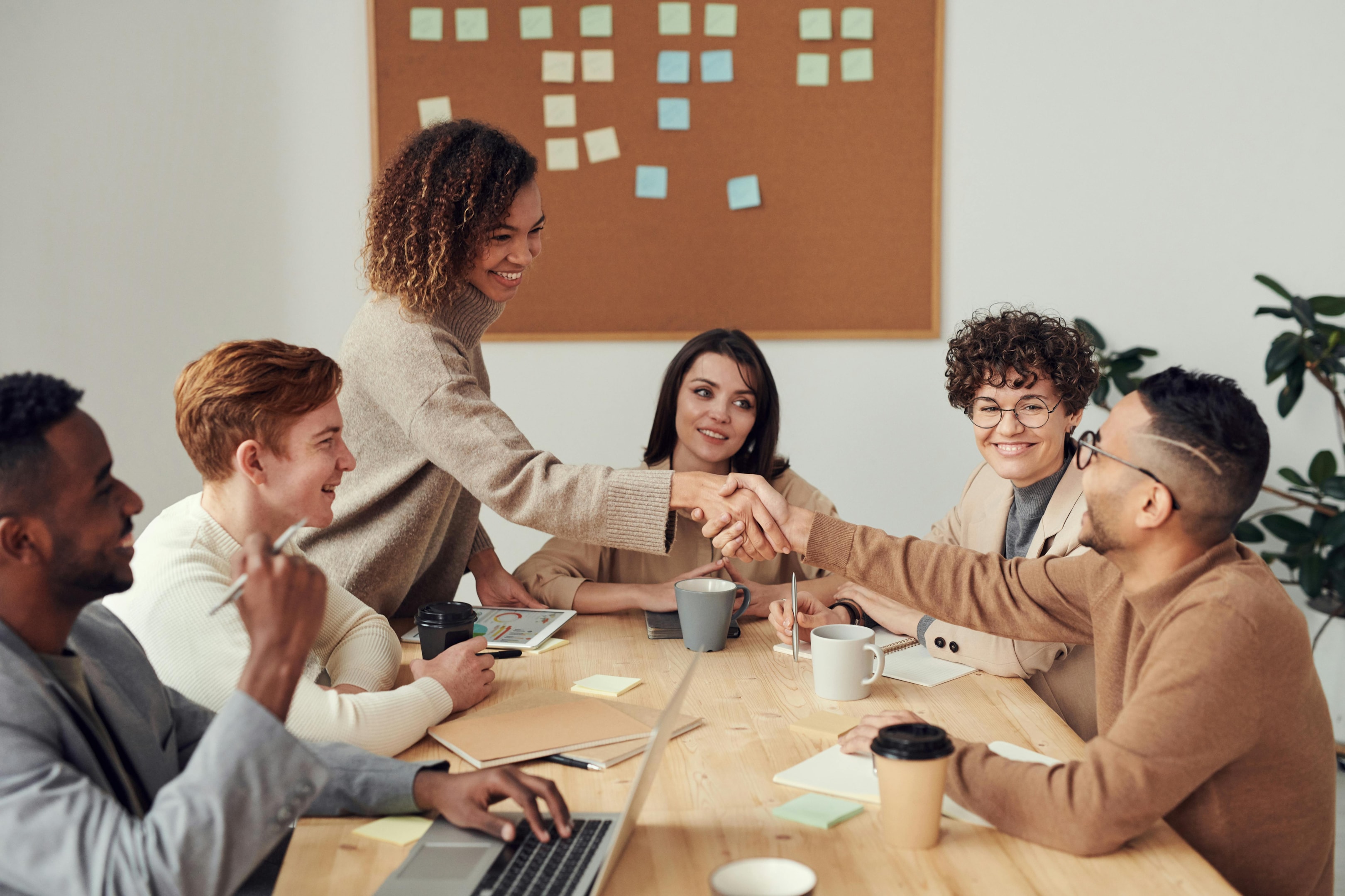 Group of real estate investors and agents meets at local networking event.
