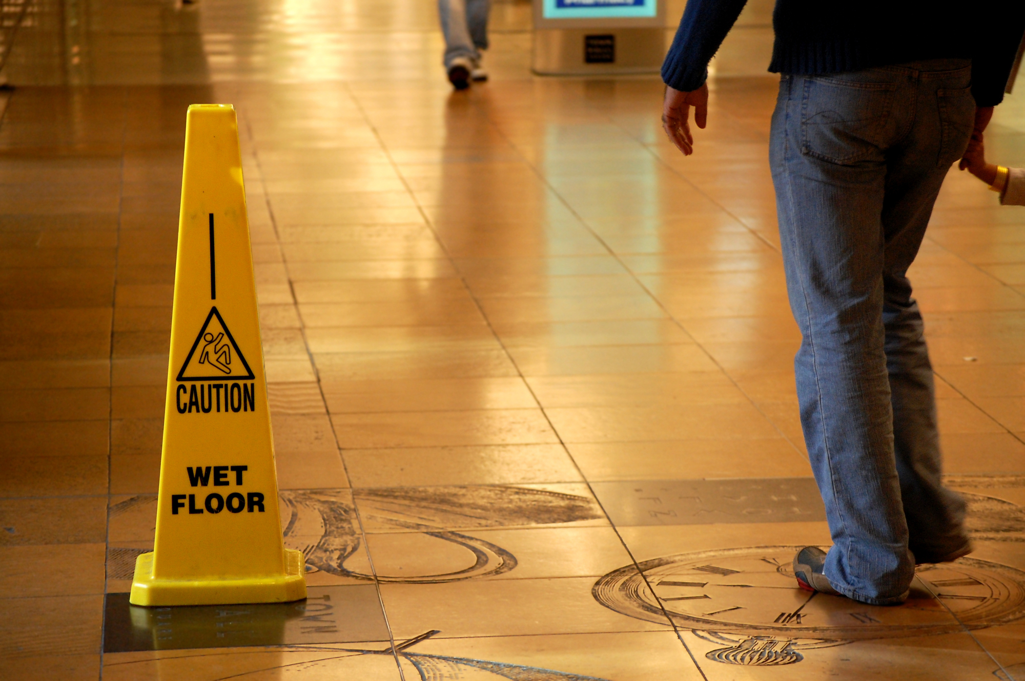 Wet floor sign - Tampa slip and fall personal accident lawyers