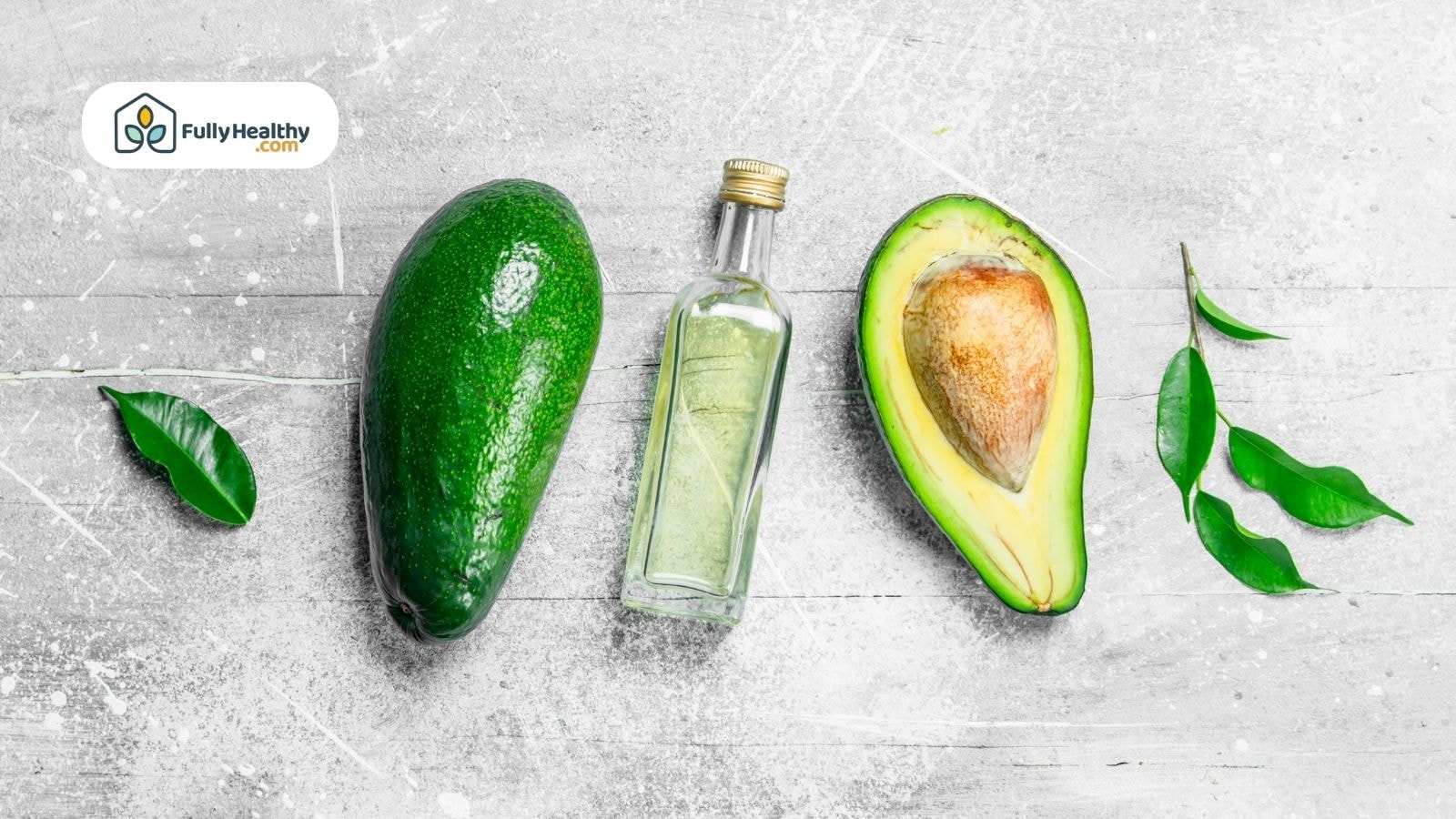 Whole avocado, sliced avocado, and clear avocado oil bottle