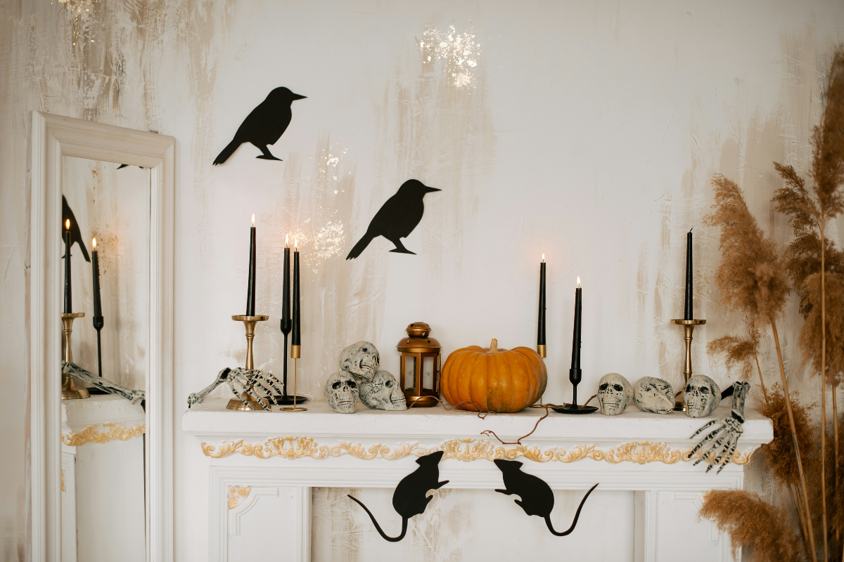 Halloween centerpieces featuring succulent pumpkins and dried flowers.