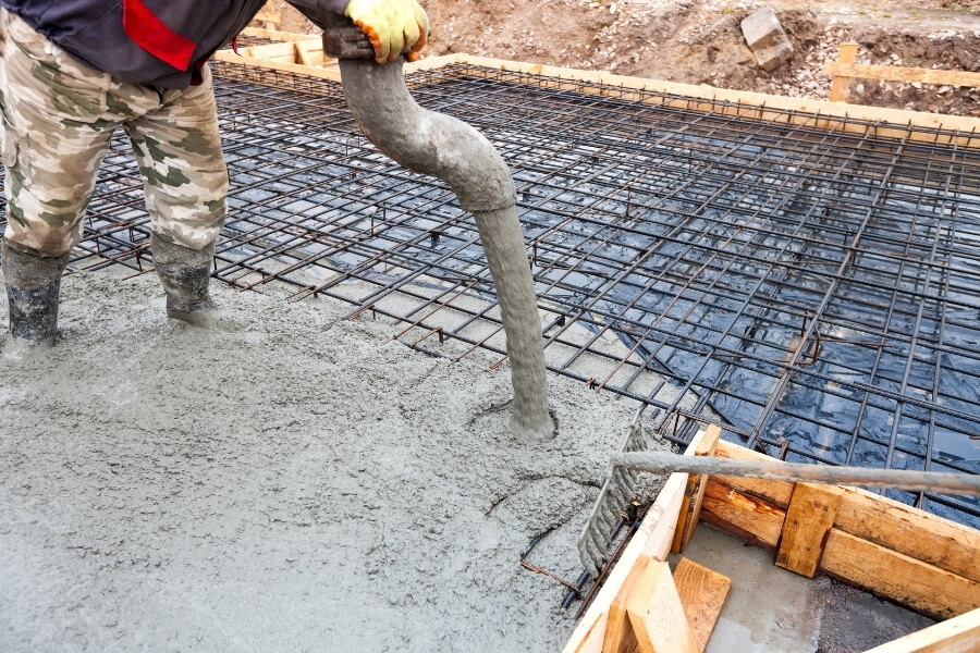A picture of self consolidating concrete being poured into a formwork