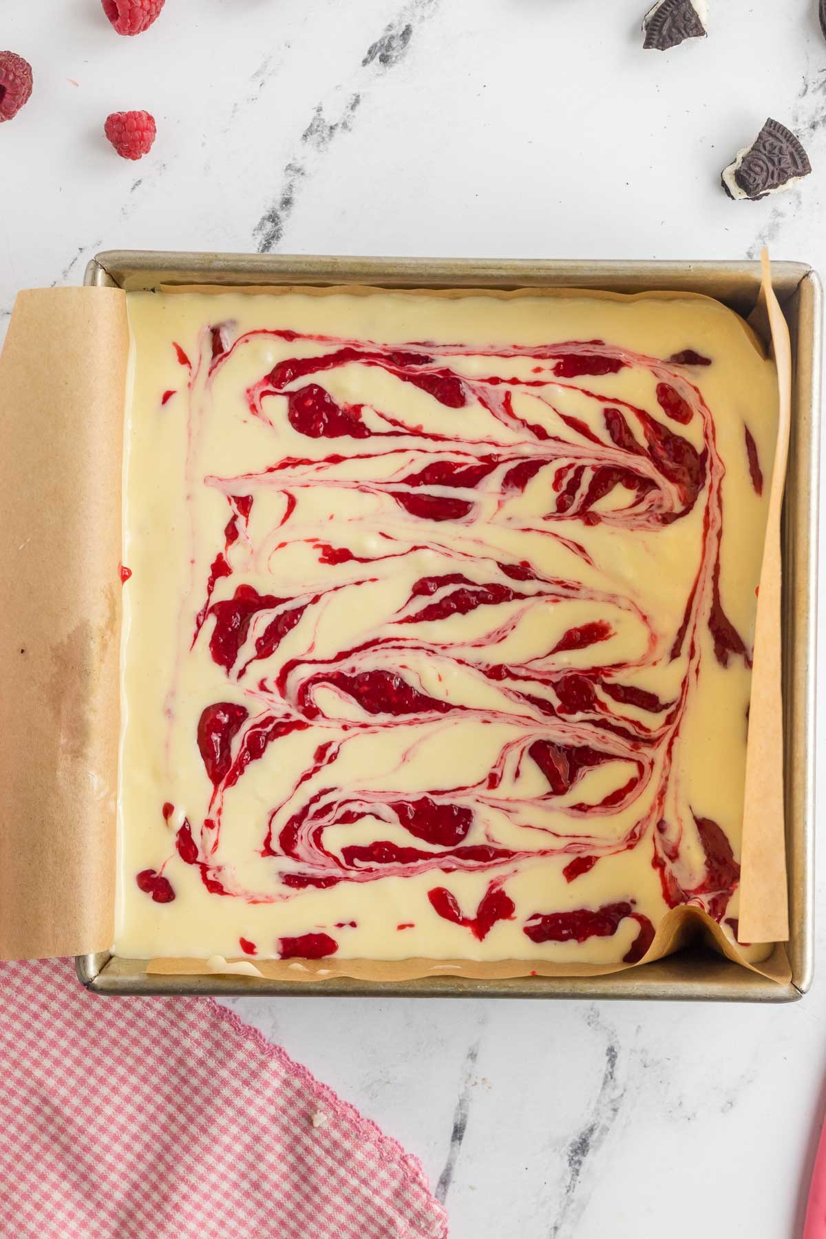 berry puree swirled throughout cheesecake squares