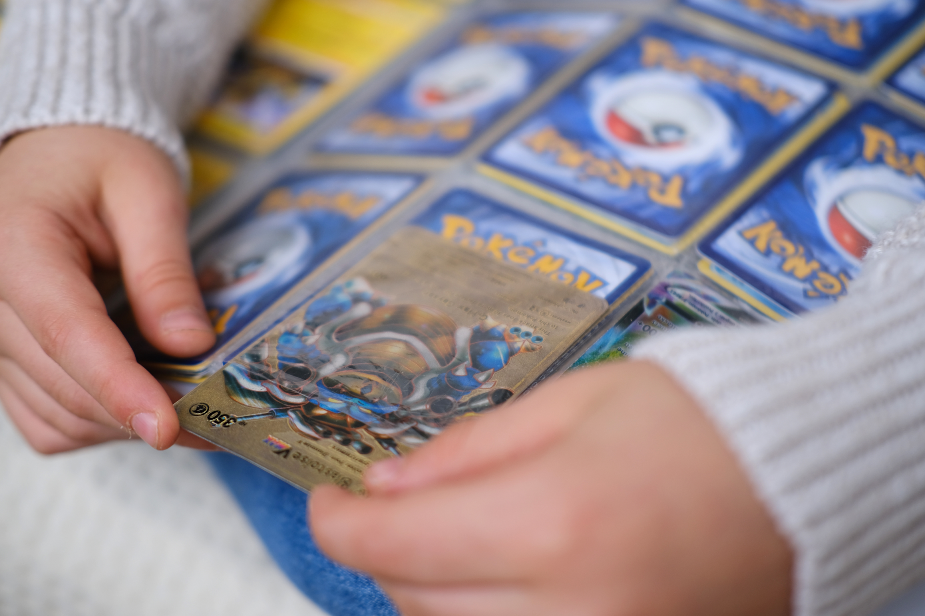 Protecting Pokemon cards from damage by putting them in a binder
