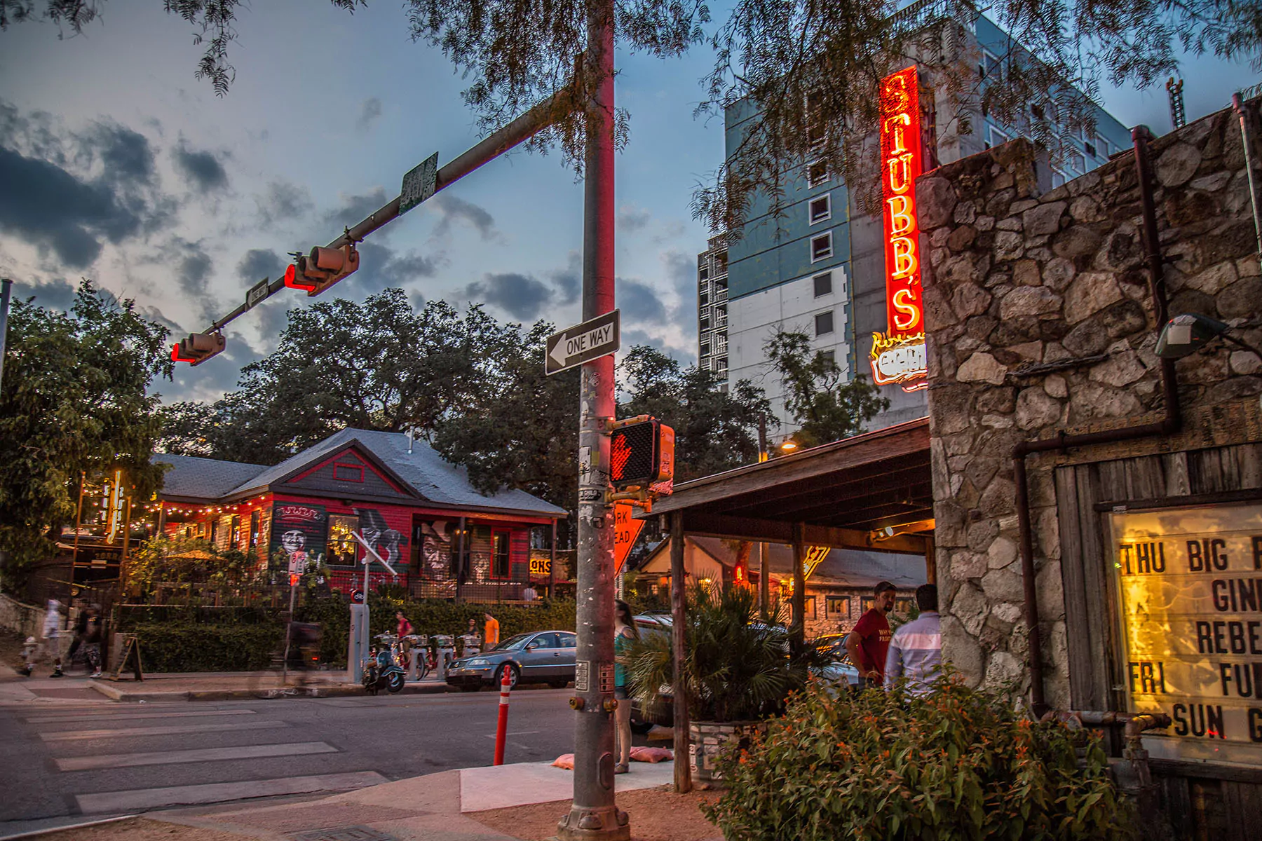 Bustling streets of the South Austin Entertainment District, highlighting new developments and multi family residential buildings in the lively Austin area.