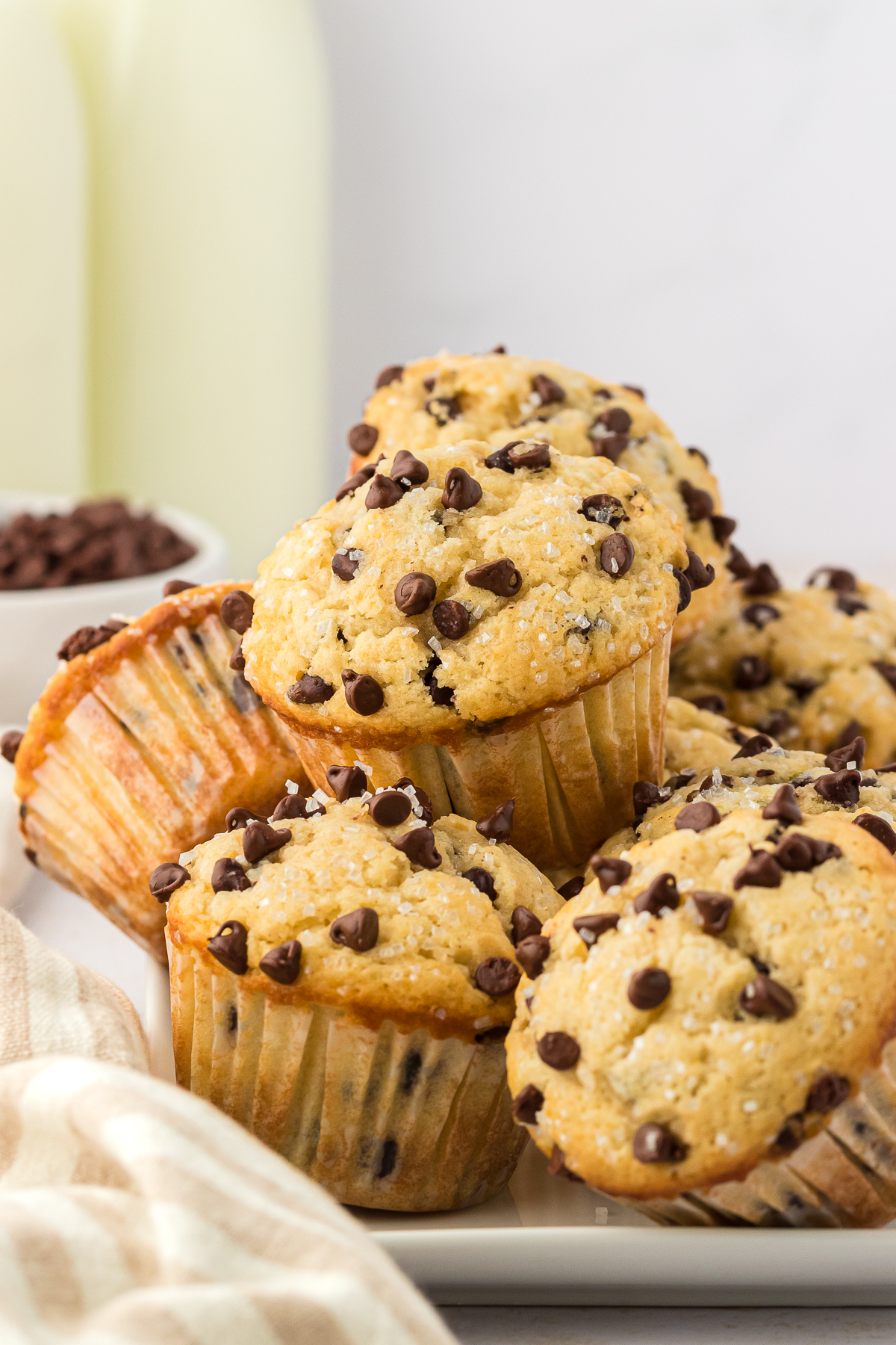 stack of chocolate chip muffins stacked on a plate