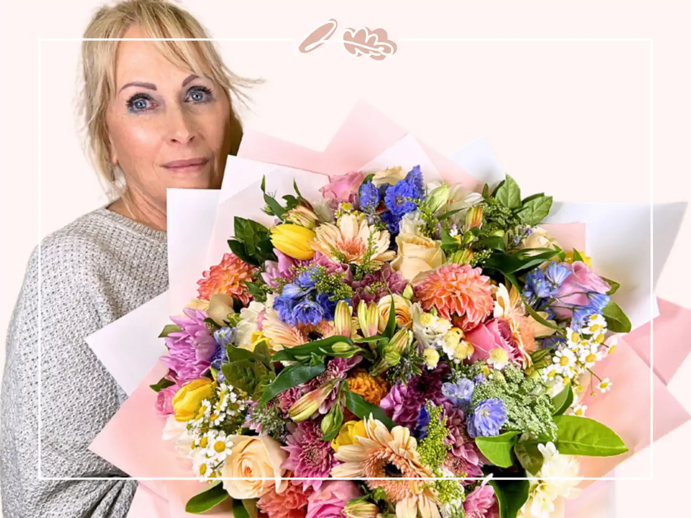 A woman holding a vibrant bouquet of mixed flowers, including roses, daisies, and lilies, symbolising beauty and harmony. Ideal for special events and new beginnings.