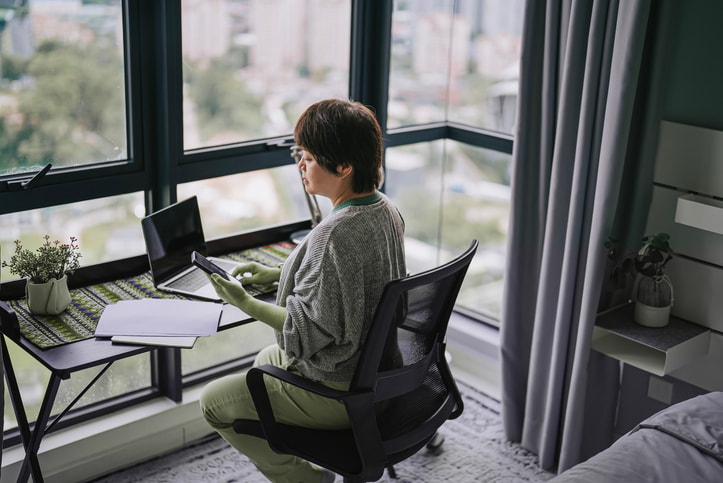 Accountant updating digital records and recording business income