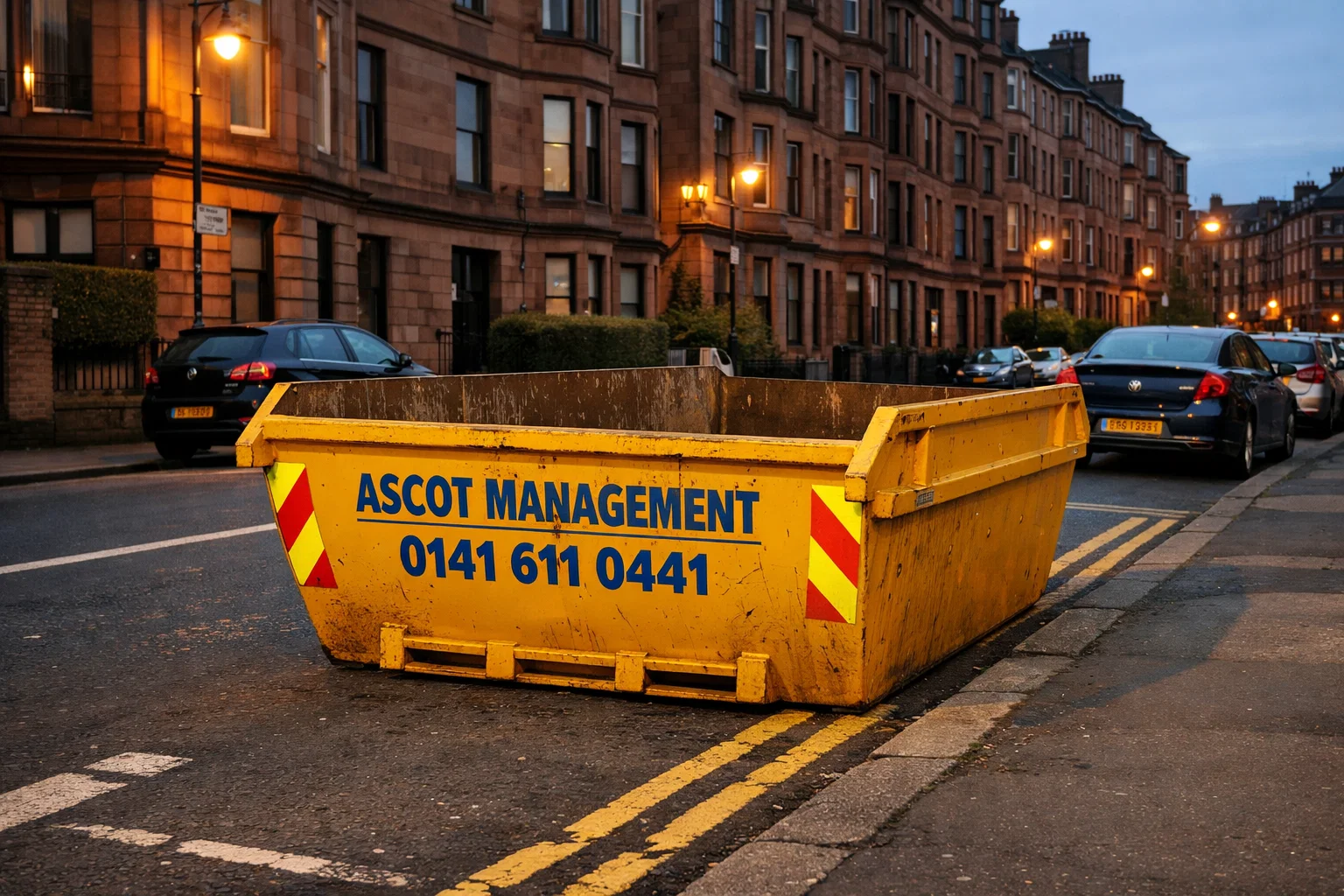 Ascot Management skip placed legally on a Glasgow roadside with safety markings and clear branding.