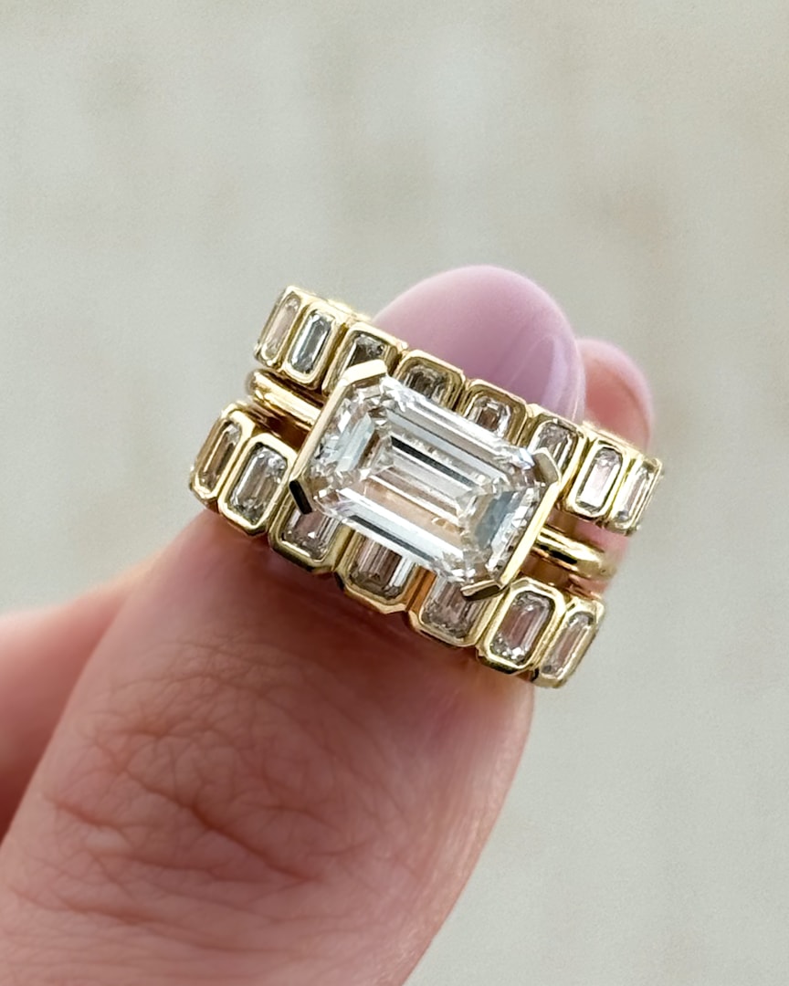 GOODSTONE East West Half Bezel Solitaire Engagement Ring With Emerald Cut Diamond