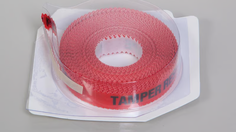 Clear-packaged red security tape designed for tamper-evident packaging