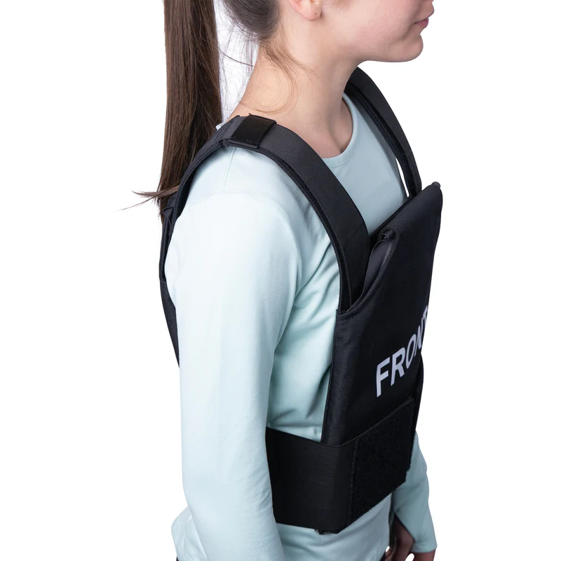 Female teen showing the correct fitting for a bulletproof vest