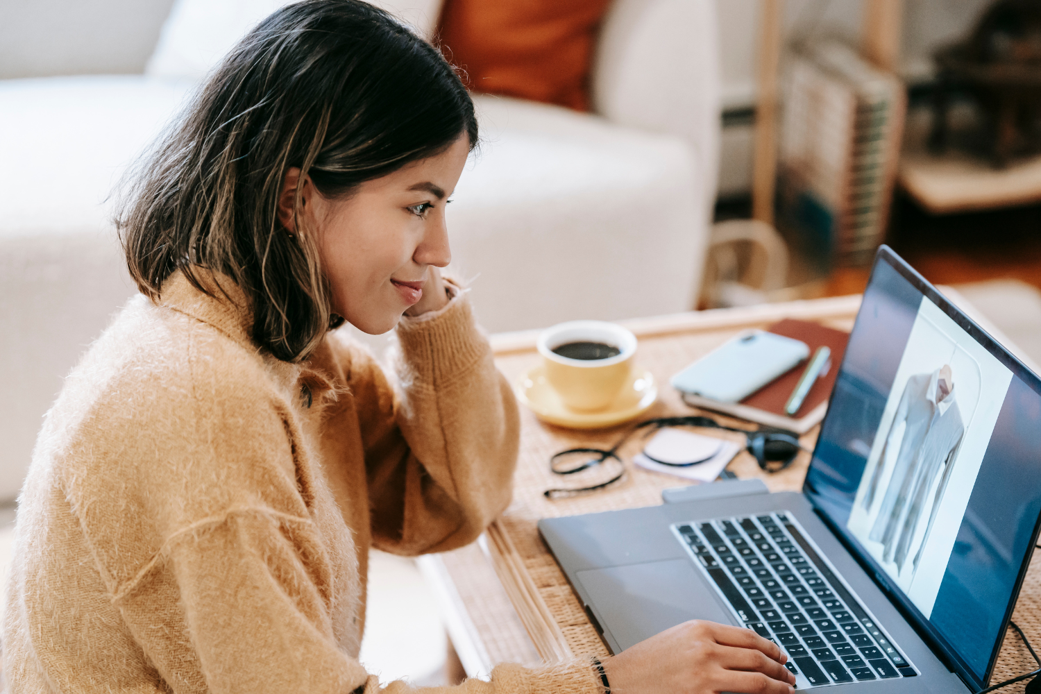 A Filipina remote worker on her laptop.