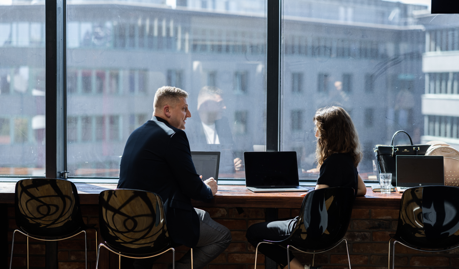 Two people during a user interview at office