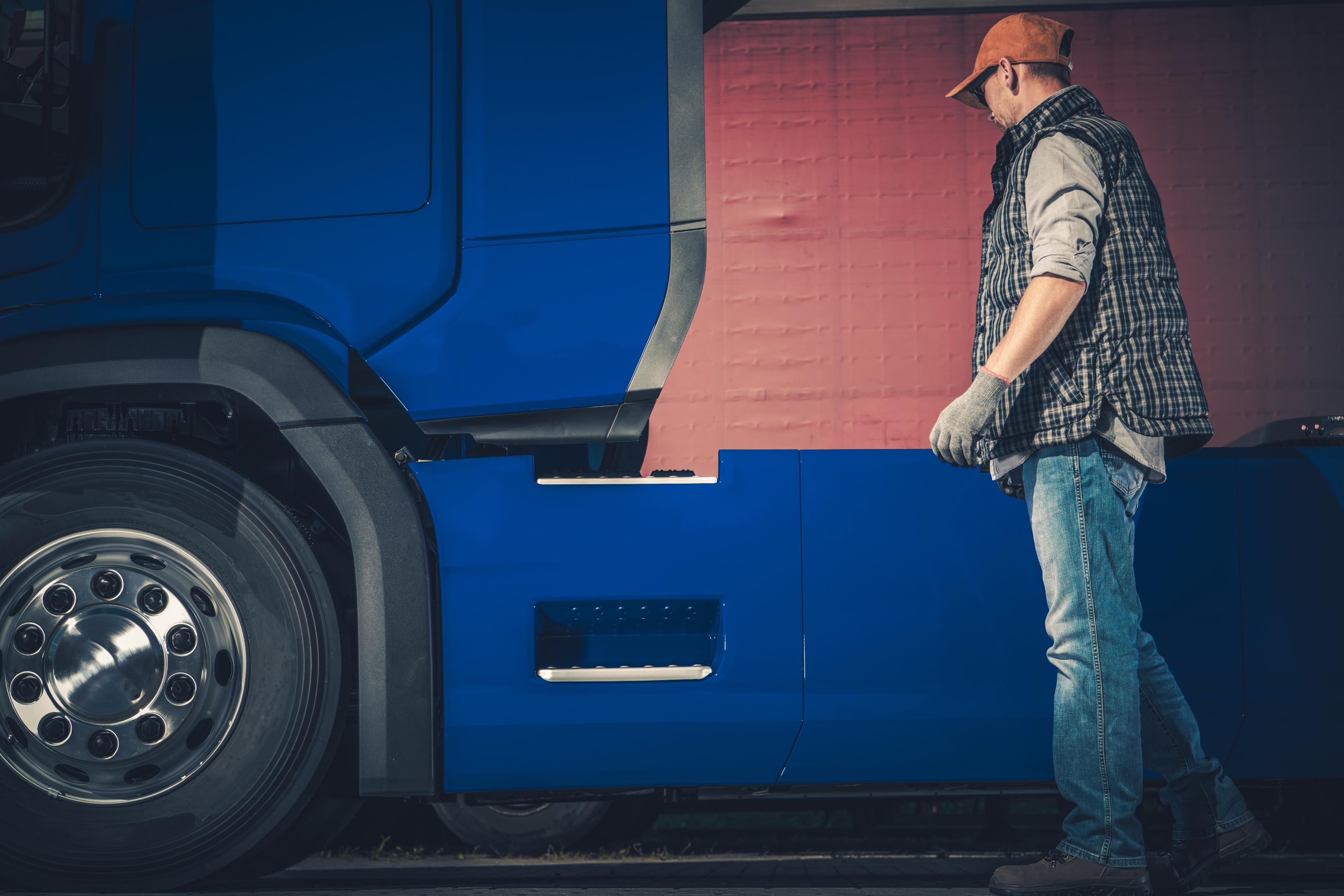 a fleet manager inspecting his vehicle; schedule preventive maintenance to keep trucks performing optimally