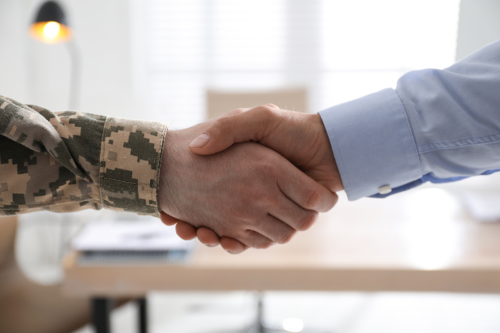 Veteran and employer shaking hands. 