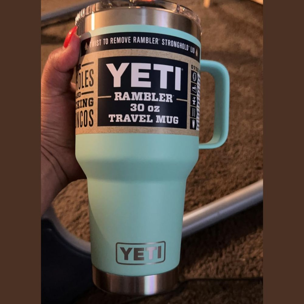A Yeti Rambler tumbler with a stainless steel body and a straw lid, with limited edition colors
