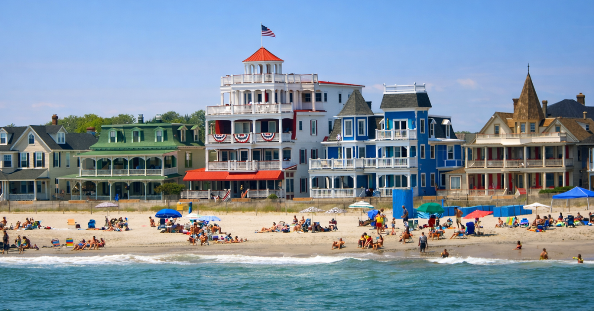 Cape May beachfront with colorful Victorian oceanfront homes and beachgoers along the Jersey Shore