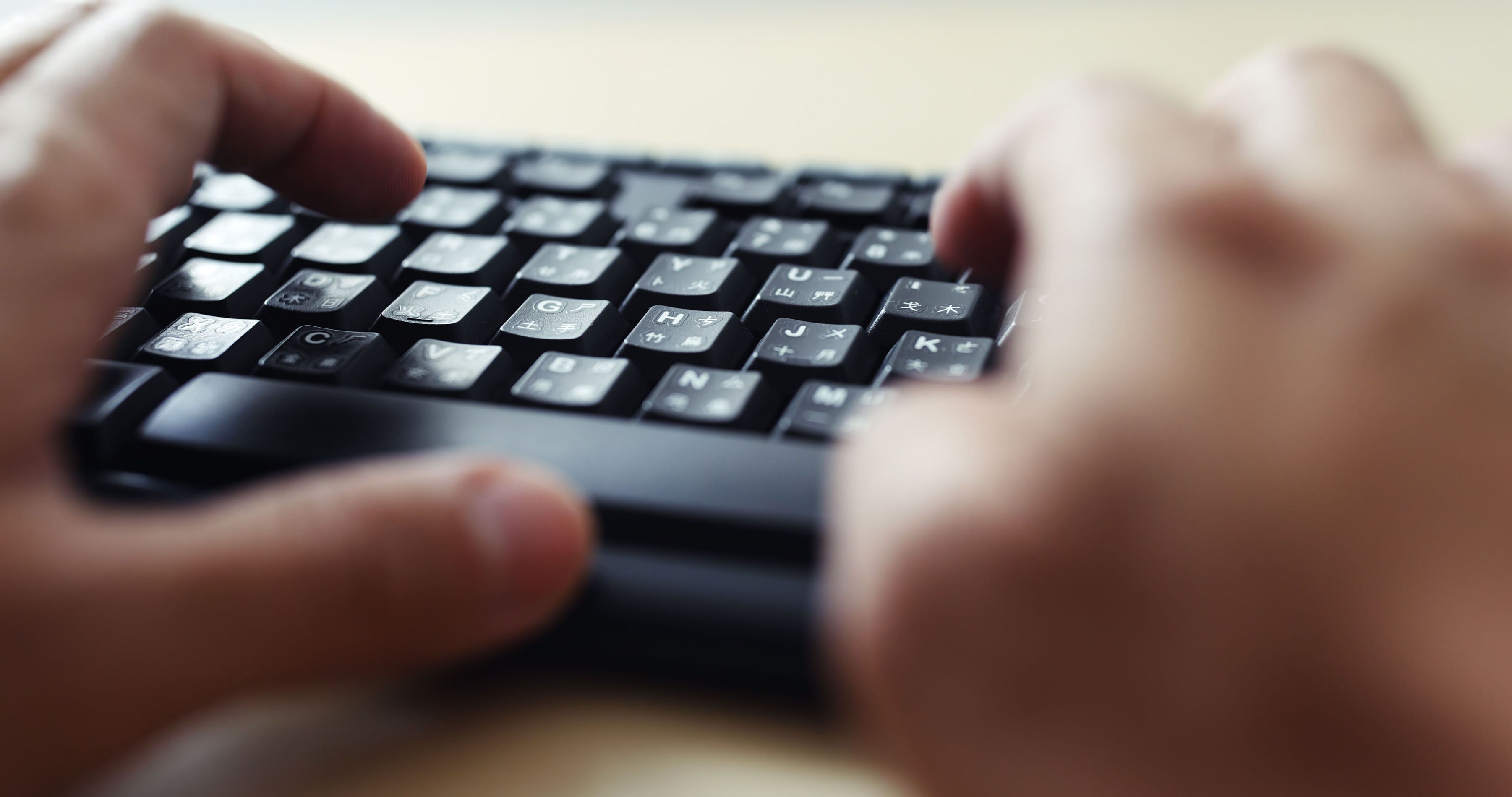 Close up of typing on keyboard