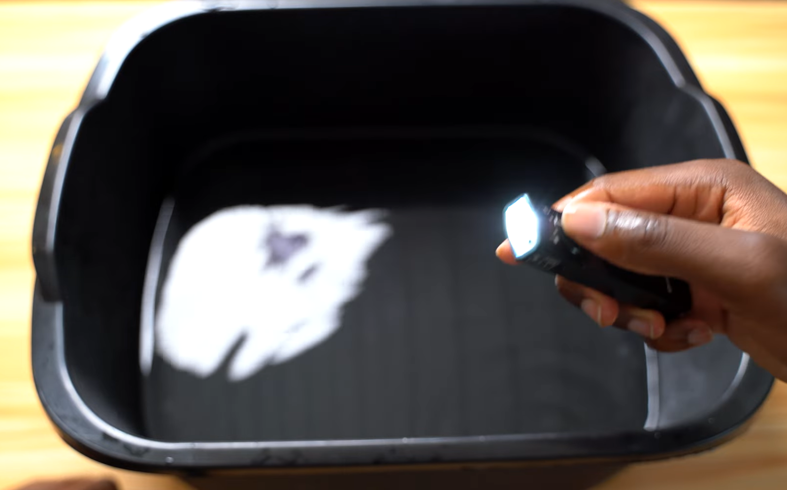 OLIGHT Arkfled flashlight submerged in water