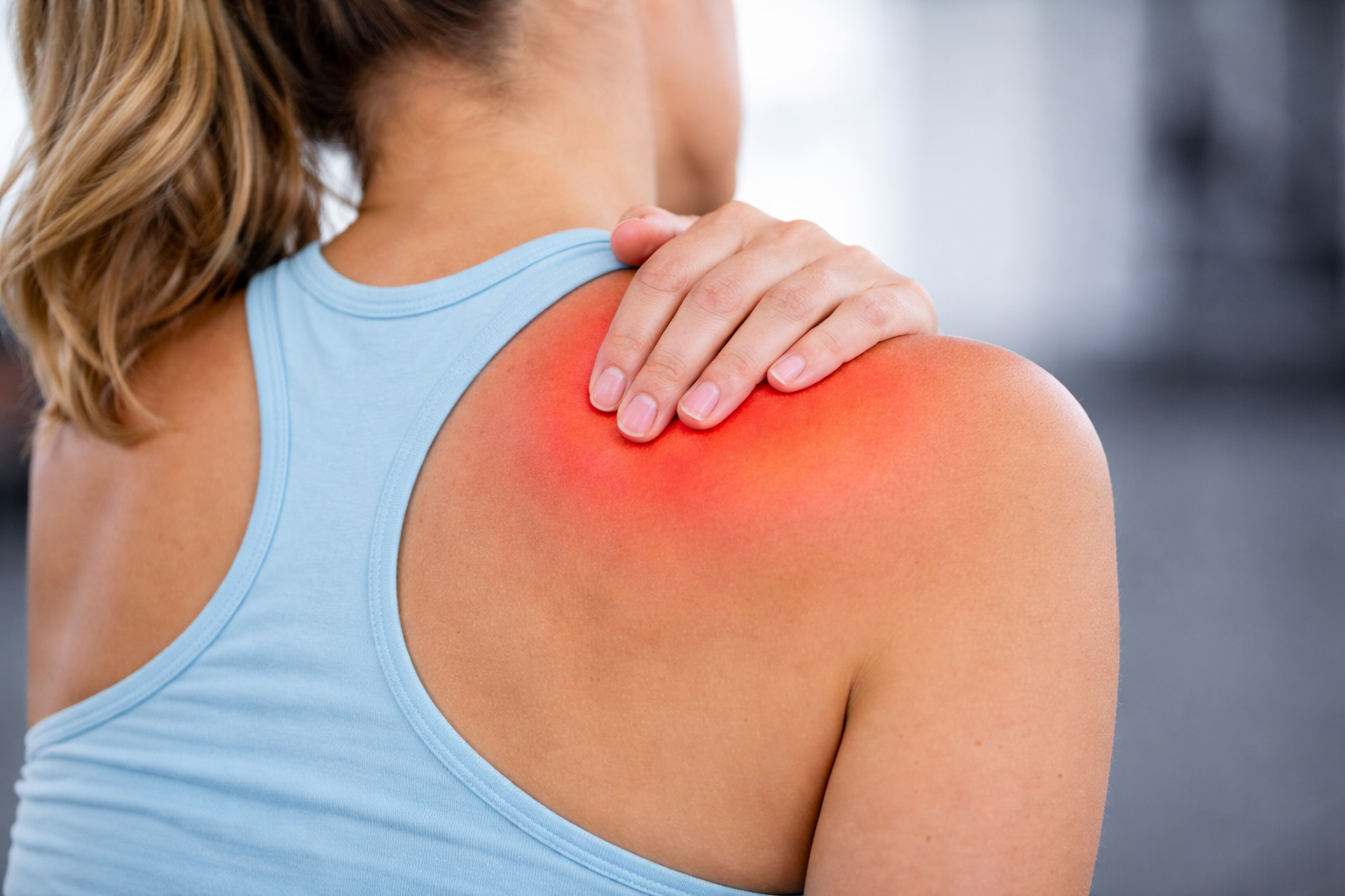 Close-up of inflamed shoulder area showing localized pain and irritation