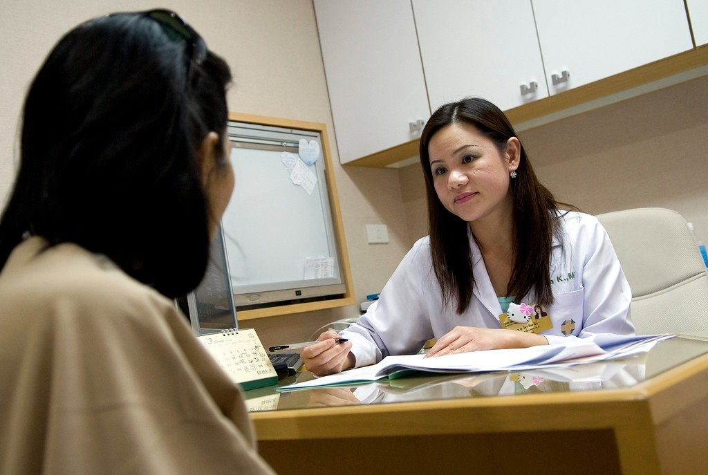 International student consulting a female doctor
