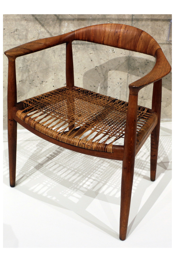 The Round Chair by Hans Wegner among a dozen chairs by him, photographed  in the Milwaukee Art Museum