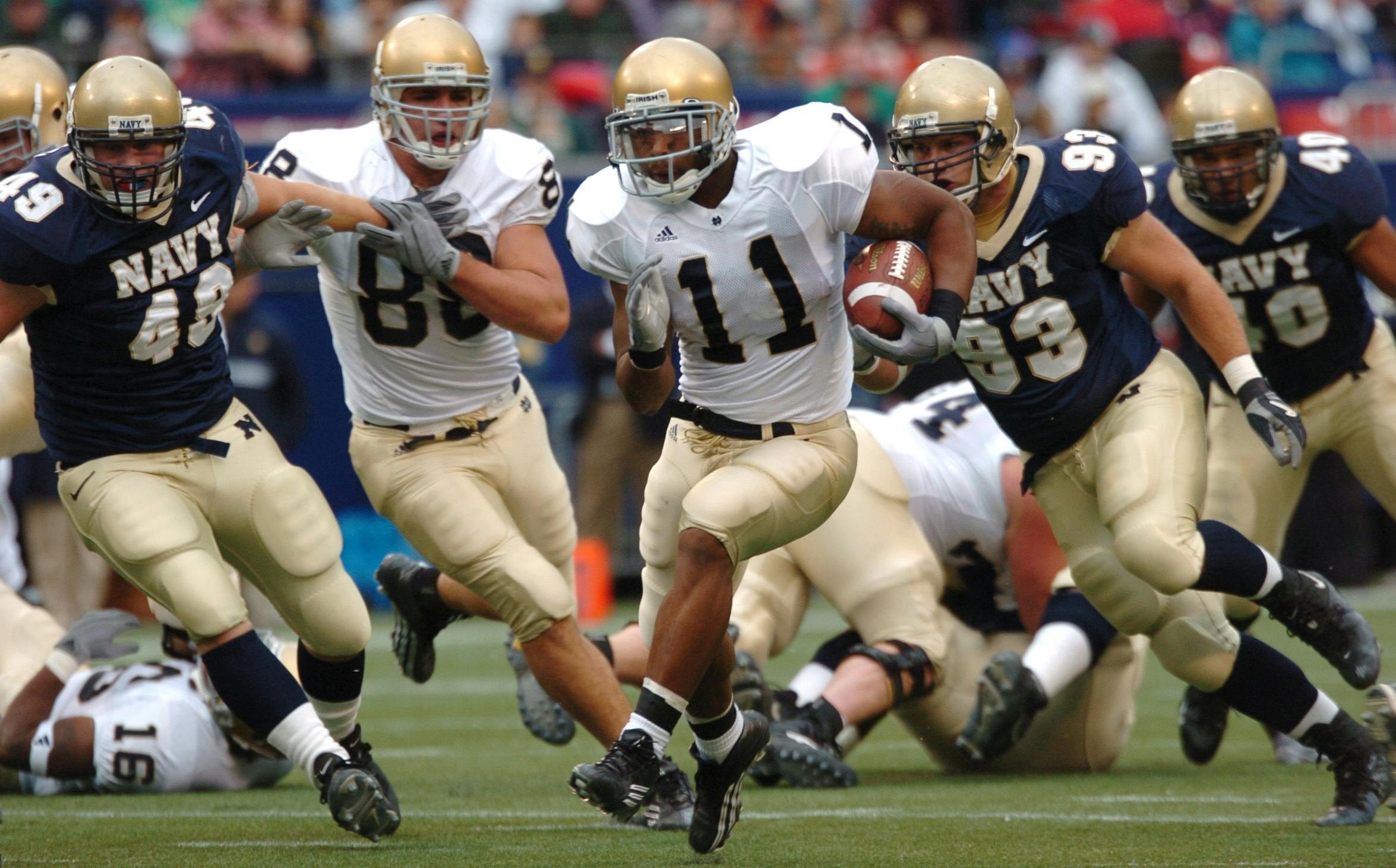 Photo by Pixabay: https://www.pexels.com/photo/group-of-male-football-players-running-on-field-during-day-163449/