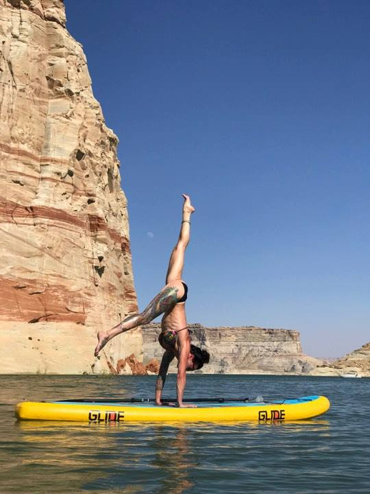 sup yoga on a paddle board