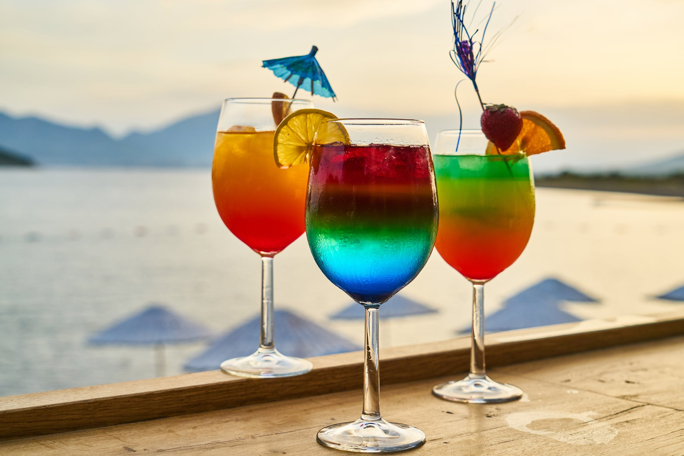 cranberry juice, chilled coupe glass, mini umbrellas