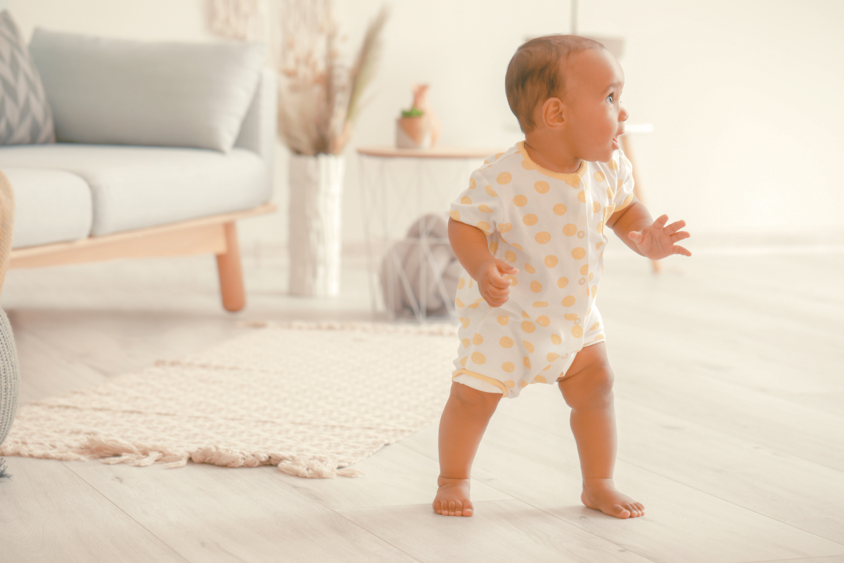 Baby standing. Poppyseed Play