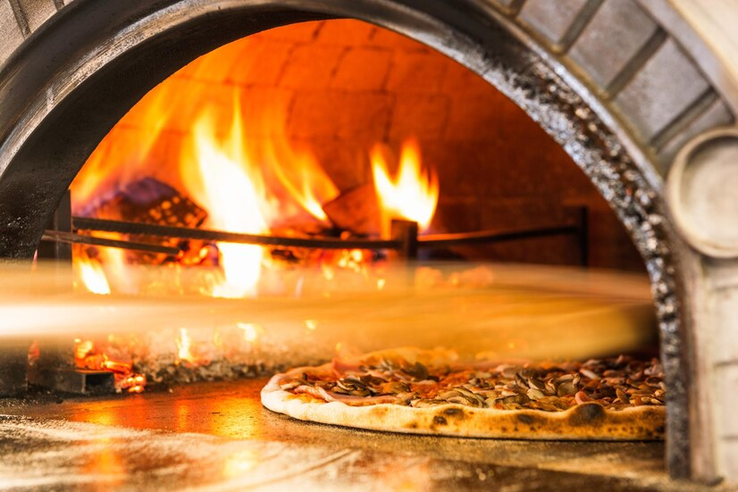 hot stone oven with pizza inside