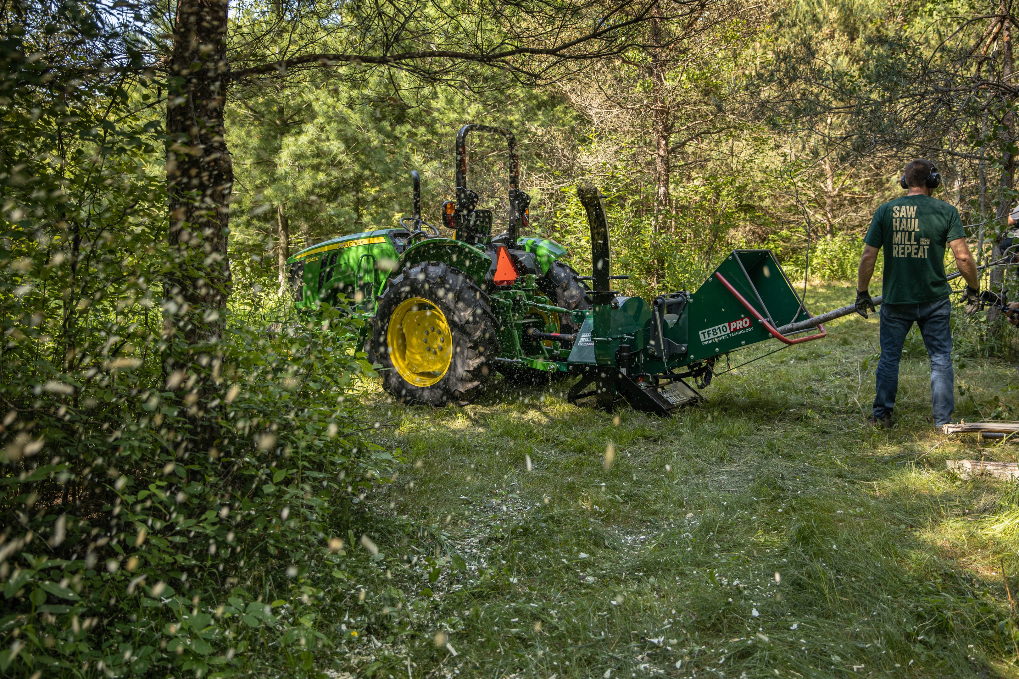 A Woodland Mills TF810 PRO milling up trees on a forest stand.