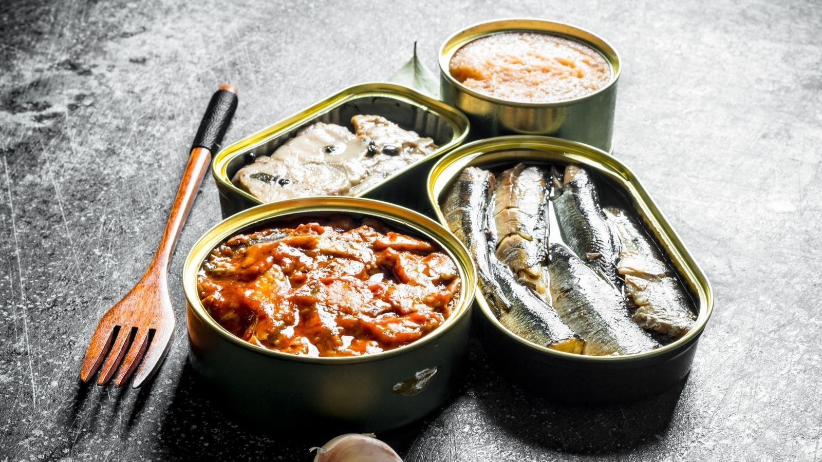Assorted canned seafood with mackerel, sardines, and shellfish packed in oil